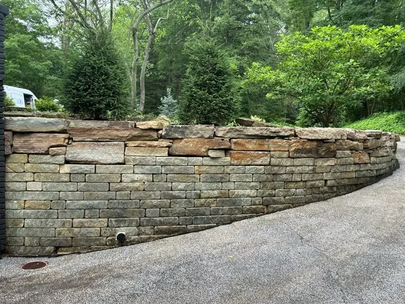 Stone retaining wall in Moreland Hills, Ohio, after cleaning by Patty's Pressure Washing