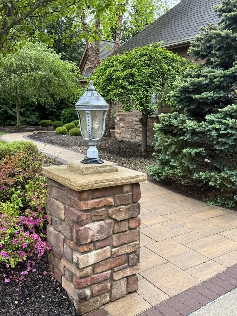 Stone pillar and lantern in Solon, Ohio, after cleaning by Patty's Pressure Washing