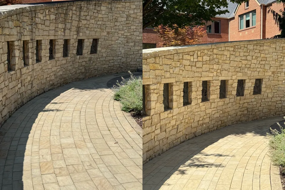 Before and after of a curved limestone wall and paver walkway cleaned at a commercial property in Cleveland, Ohio, by Patty's Pressure Washing