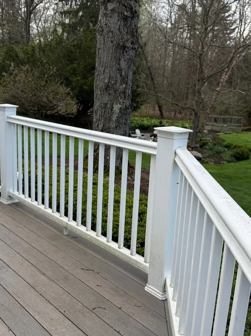 Composite deck and white railing in Chagrin Falls, Ohio, before cleaning