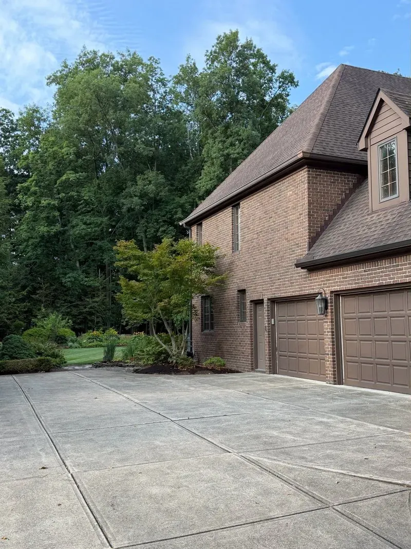 Concrete driveway and garage apron in Westlake, Ohio, before cleaning