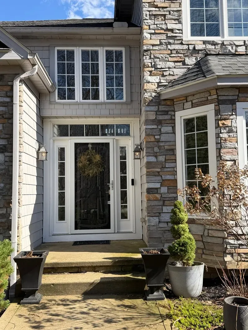 Stone and shake-sided entry in Chagrin Falls, Ohio, before cleaning