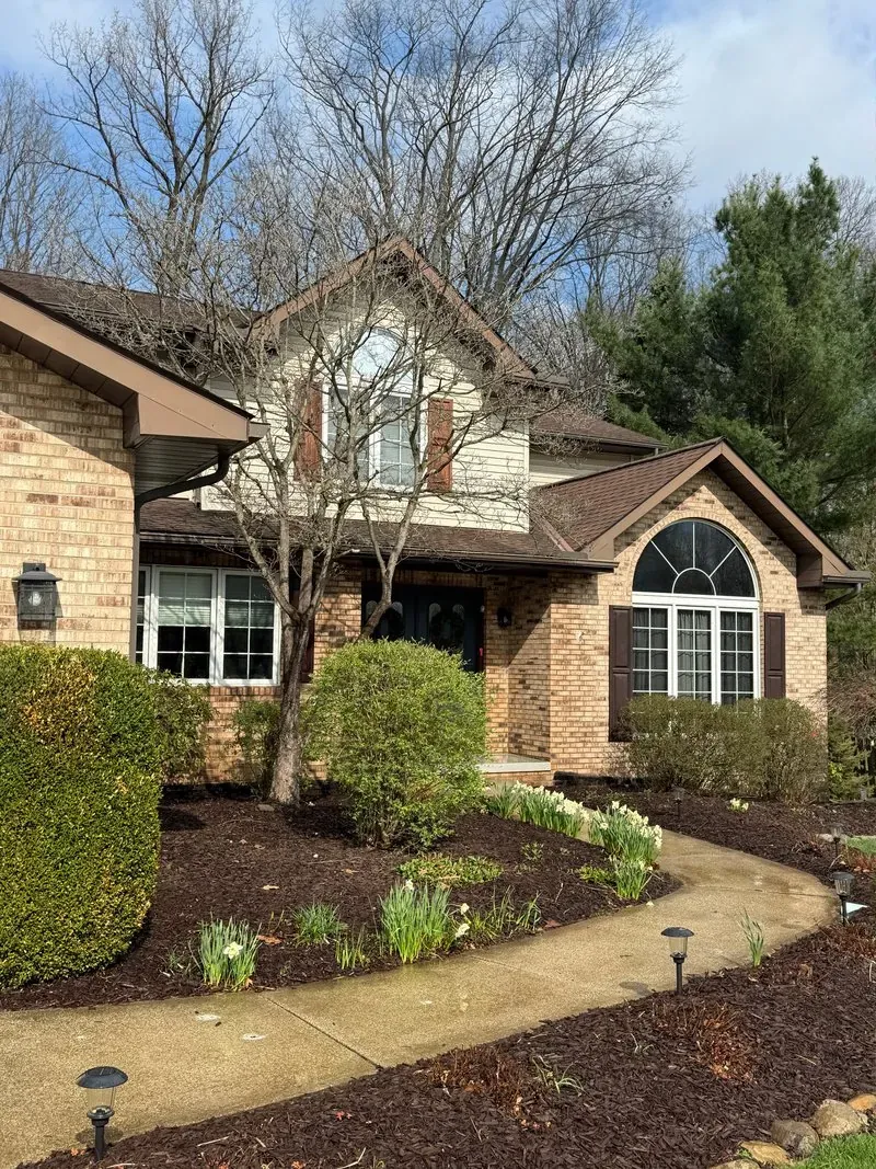 Brick facade and curved front walk in Valley View, Ohio, before cleaning