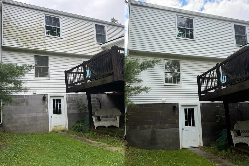 Before and after house soft wash removing green algae from white vinyl siding in Chagrin Falls, Ohio, by Patty's Pressure Washing