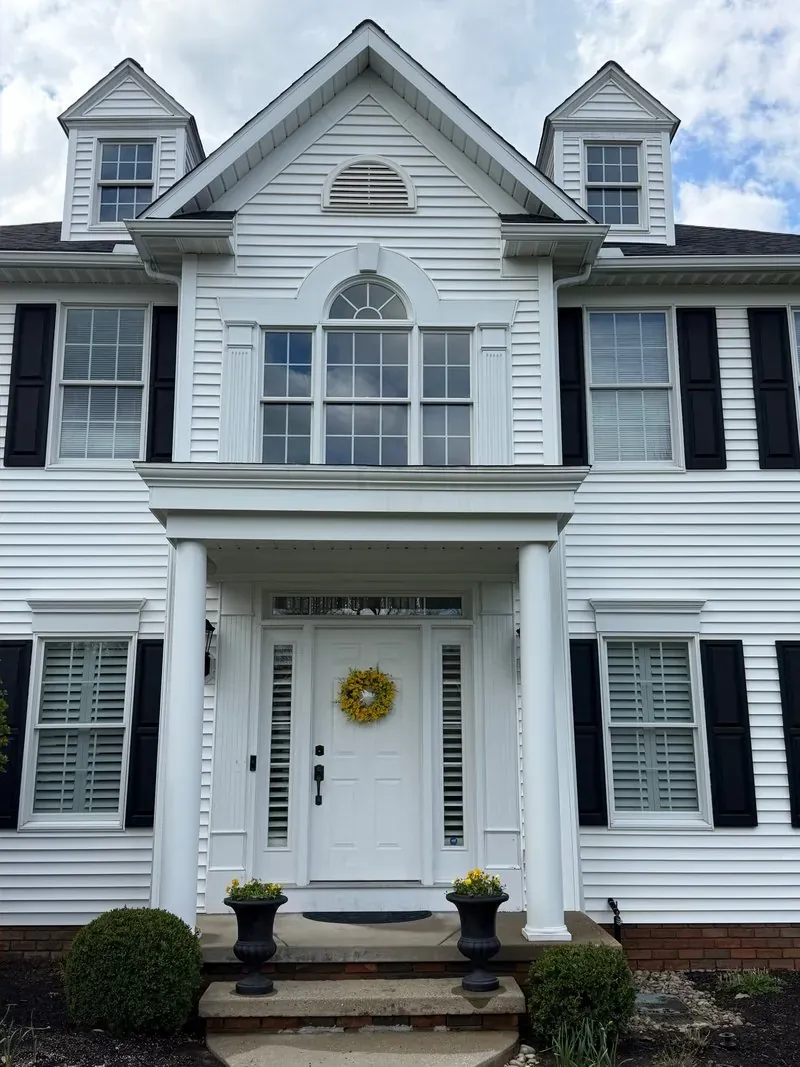 White colonial and portico in Chagrin Falls, Ohio, after cleaning by Patty's Pressure Washing