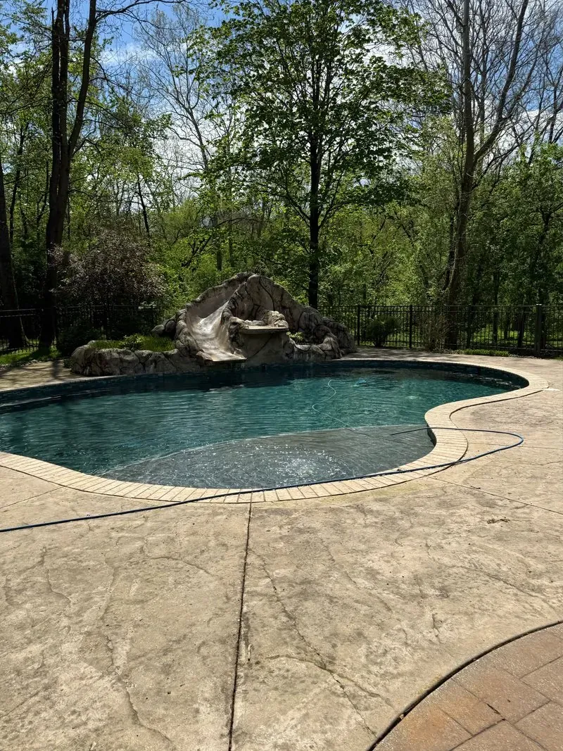 Stamped-concrete pool deck in Bentleyville, Ohio, before cleaning