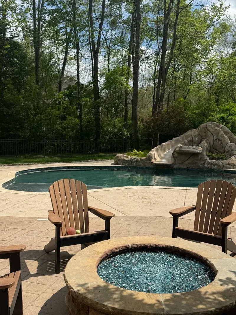 Fire pit and pool deck in Bentleyville, Ohio, after cleaning by Patty's Pressure Washing