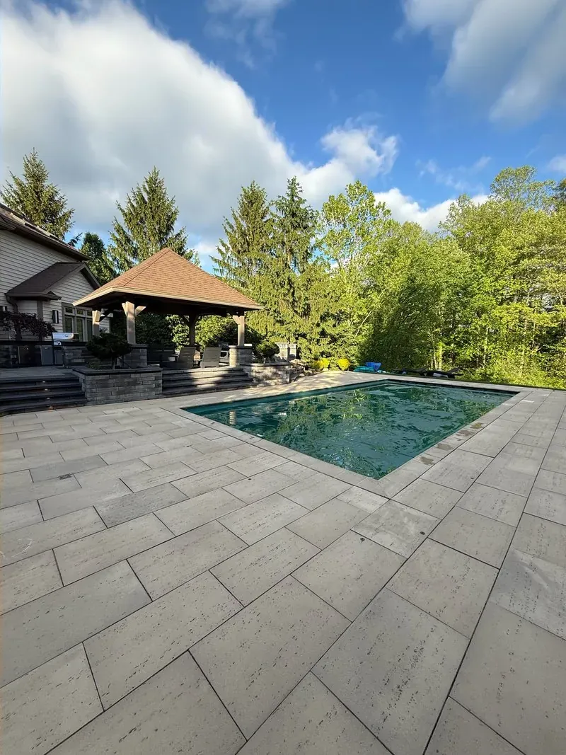 Paver pool deck and pavilion in Pepper Pike, Ohio, after cleaning by Patty's Pressure Washing