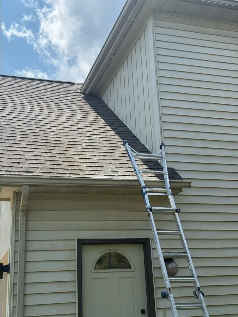 Shingle roof and gable siding in Chagrin Falls, Ohio, after cleaning by Patty's Pressure Washing
