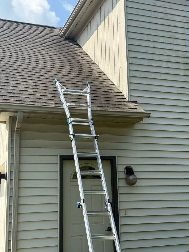 Shingle roof and gable siding in Chagrin Falls, Ohio, before cleaning