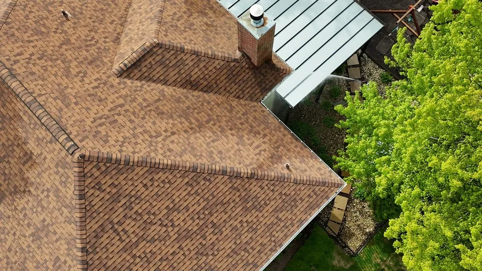Cleaned asphalt shingle roof seen from above after soft washing in Orange, Ohio, by Patty's Pressure Washing