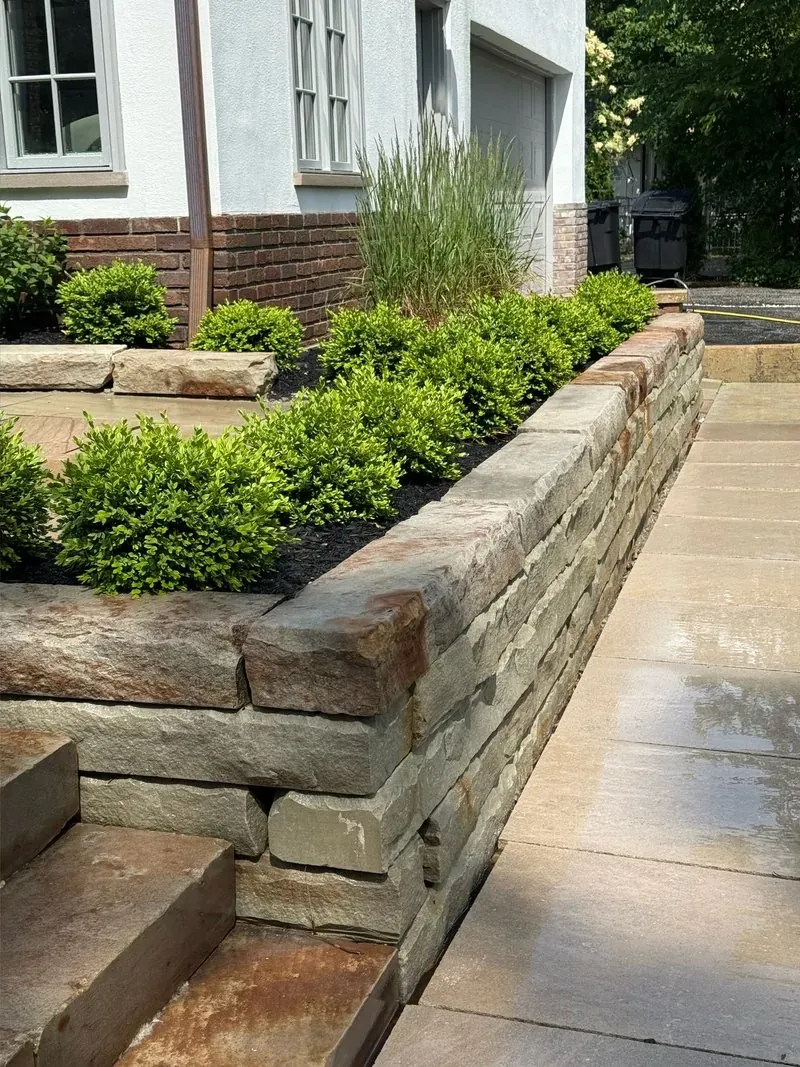 Sandstone retaining wall and steps in Beachwood, Ohio, after cleaning by Patty's Pressure Washing