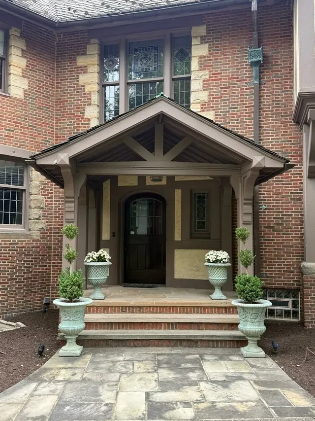 Sandstone entry walk and portico in Shaker Heights, Ohio, before cleaning
