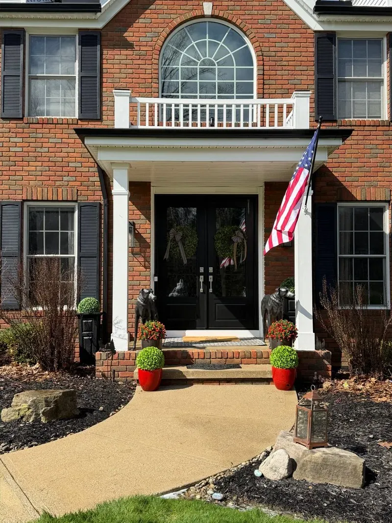 Brick entry and concrete front walk in Bainbridge Township, Ohio, after cleaning by Patty's Pressure Washing