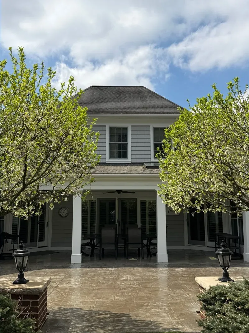 Stamped-concrete patio and covered porch in Bainbridge Township, Ohio, after cleaning by Patty's Pressure Washing