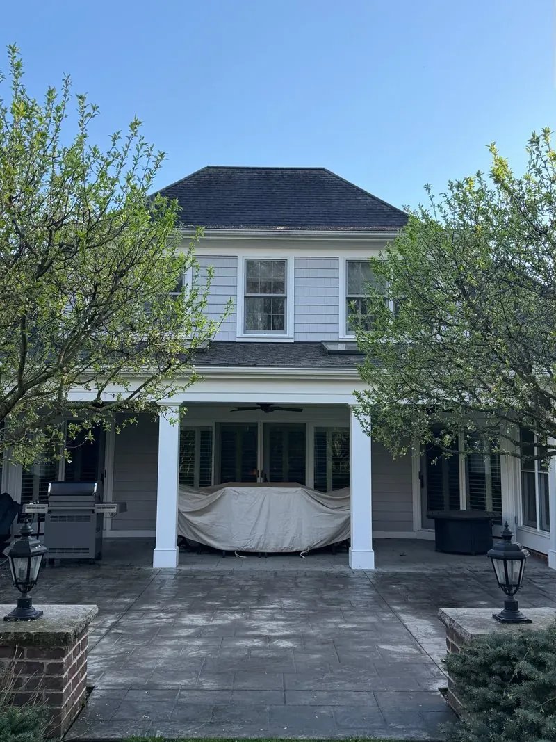 Stamped-concrete patio and covered porch in Bainbridge Township, Ohio, before cleaning