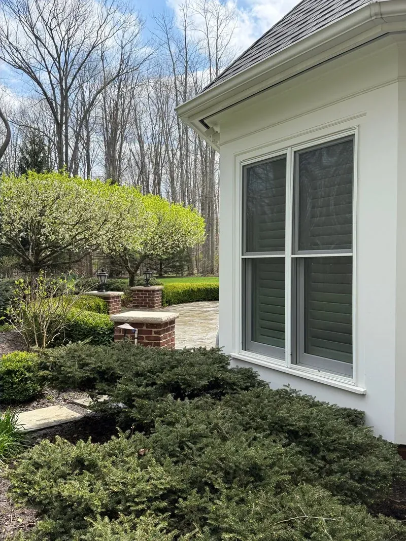 Window trim and brick pillar in Bainbridge Township, Ohio, after cleaning by Patty's Pressure Washing
