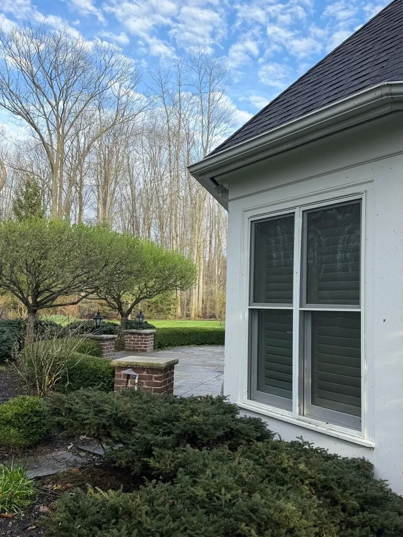 Window trim and brick pillar in Bainbridge Township, Ohio, before cleaning