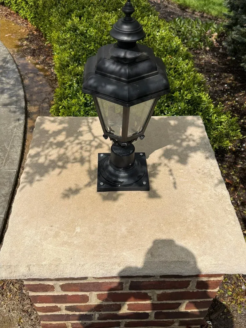 Brick pillar, stone cap and lantern in Bainbridge Township, Ohio, after cleaning by Patty's Pressure Washing