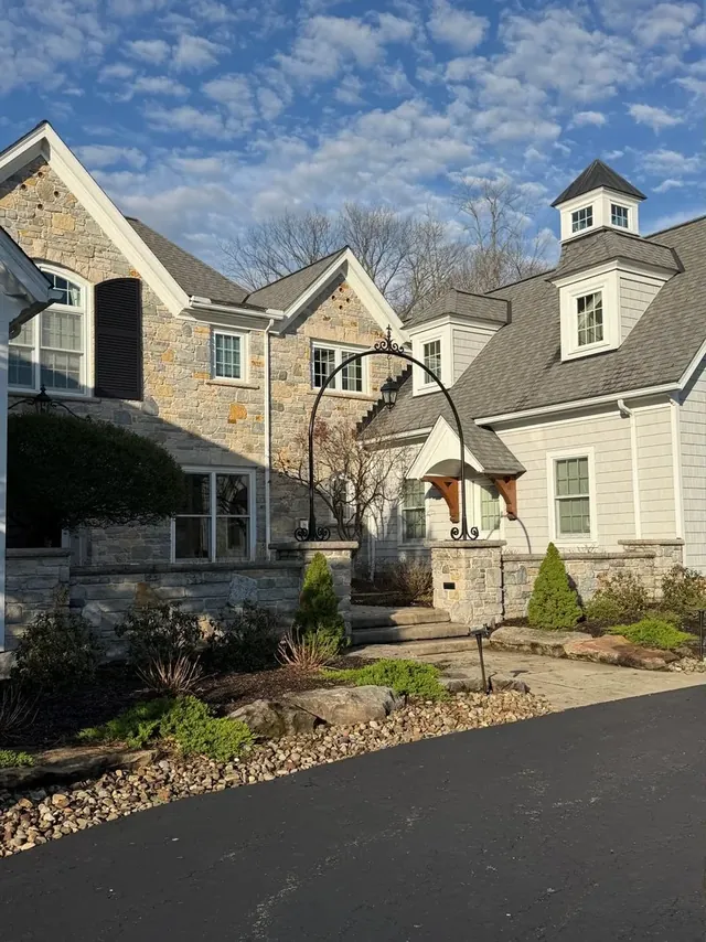 Stone house, garden wall and front steps in Bainbridge Township, Ohio, before cleaning