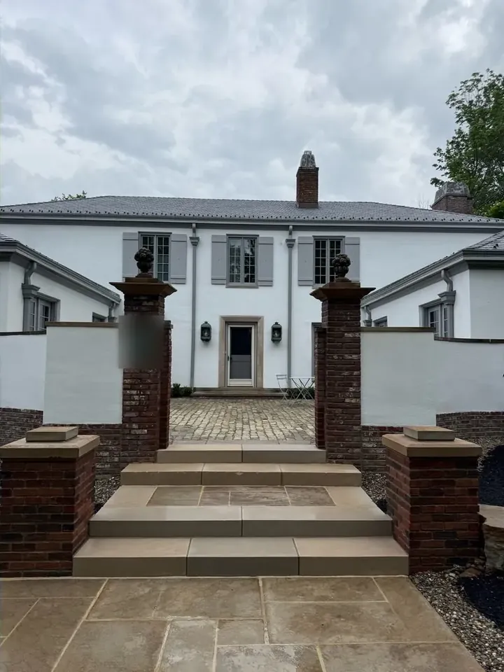 Sandstone entry steps and brick pier forecourt in Beachwood, Ohio, after cleaning by Patty's Pressure Washing