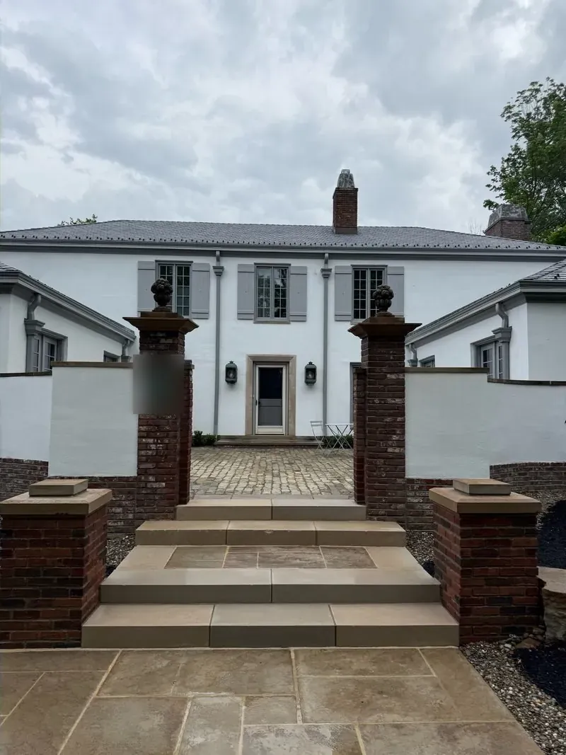 Sandstone entry steps and brick pier forecourt in Beachwood, Ohio, after cleaning by Patty's Pressure Washing