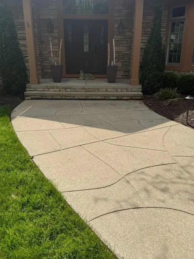 Stone front entry and exposed-aggregate walk in Bentleyville, Ohio, after cleaning by Patty's Pressure Washing
