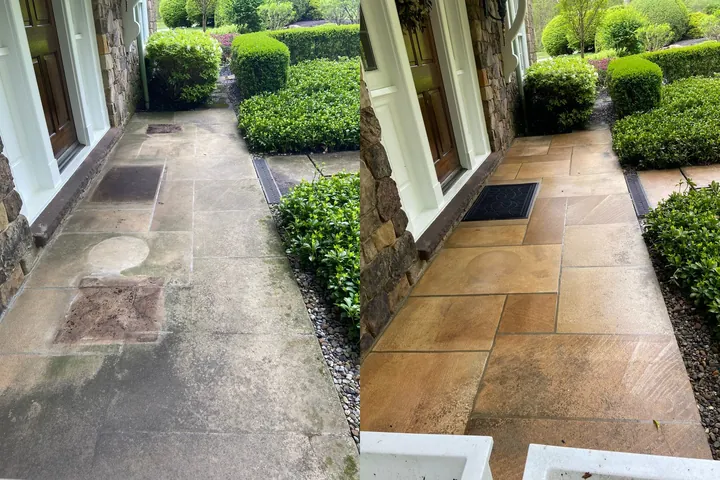Before and after of a sandstone front walkway soft washed in Gates Mills, Ohio, by Patty's Pressure Washing