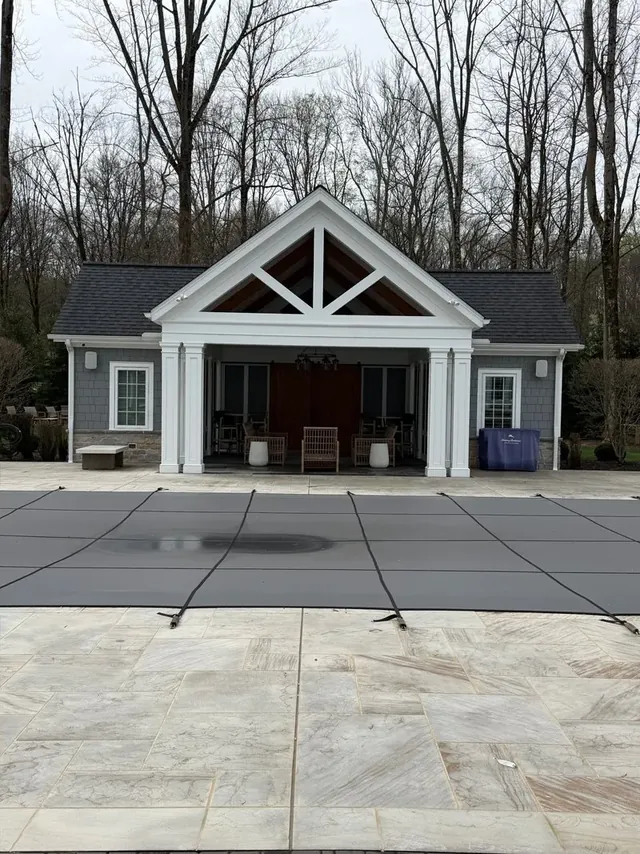 Paver pool deck and pool house in Moreland Hills, Ohio, after cleaning by Patty's Pressure Washing