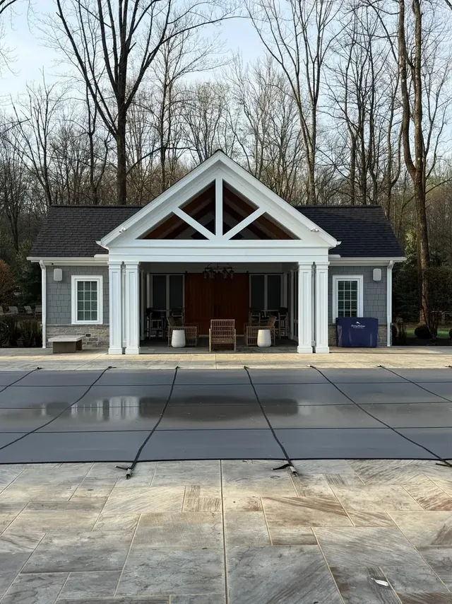Paver pool deck and pool house in Moreland Hills, Ohio, before cleaning