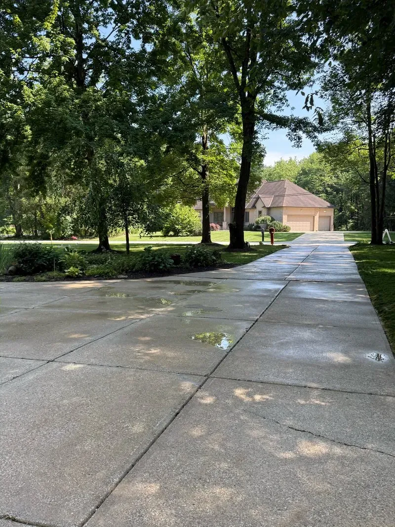 Long concrete driveway in Solon, Ohio, after cleaning by Patty's Pressure Washing