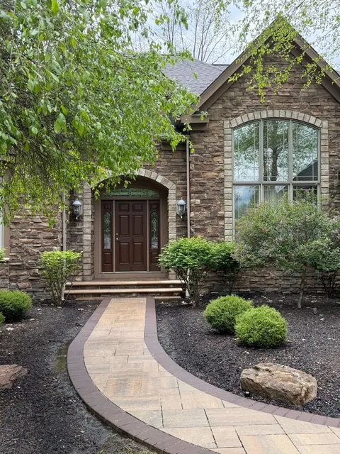 Stone entry and paver walk in Solon, Ohio, after cleaning by Patty's Pressure Washing