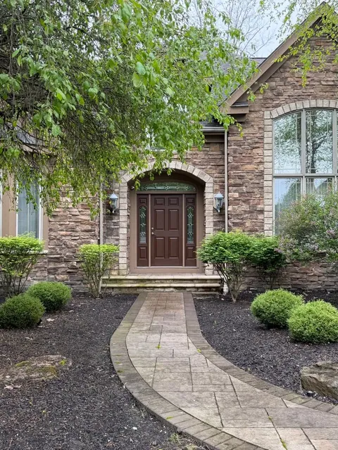 Stone entry and paver walk in Solon, Ohio, before cleaning
